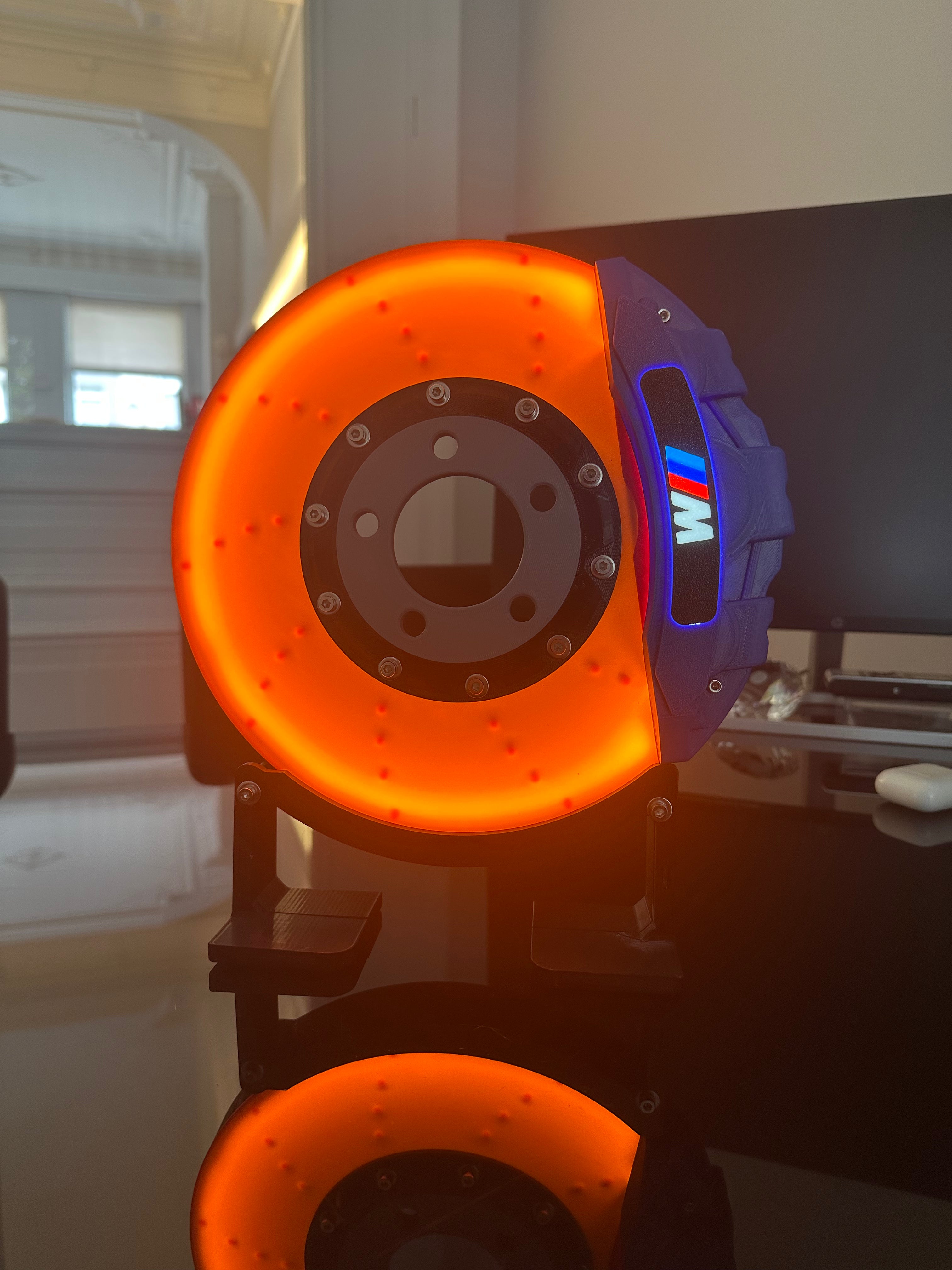 BMW M blue brake disc lamp glowing on desk